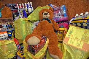 Charles Williams and family with semi-truck sized donation of toys to "Chucky's Mission"