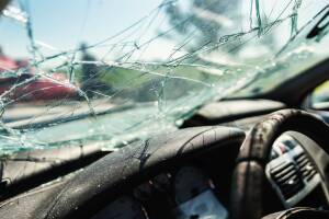 Closeup of crashed car window in car accident.