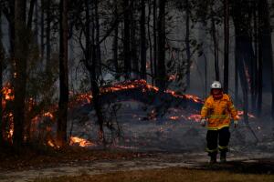 Multiple Bushfires Burning At Emergency Level Across NSW Following Death Of Volunteer Firefighter