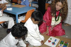 Colombian singer Shakira (R) talks with