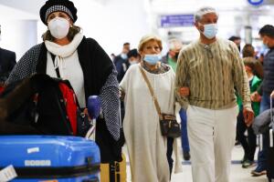 Holiday Travel Ramps Up As Omicron Cases Surge