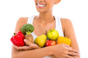 Asian woman eating healthy fruit
