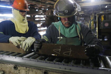 Workers cut bricks to build a new furnance at the Hayden Smelter. The small mining communities of Kearny and Hayden Arizona are in the heart of the Copper Basin in Arizona's Sonoran Desert. A giant open pit copper mine and a nearby smelter have been operating in the area for over 100 years. Almost everyone in the area works for the mine, now owned by the Mexican company ASARCO, and many families are third and fourth generation miners. (Photo by Andrew Lichtenstein/Corbis via Getty Images)
