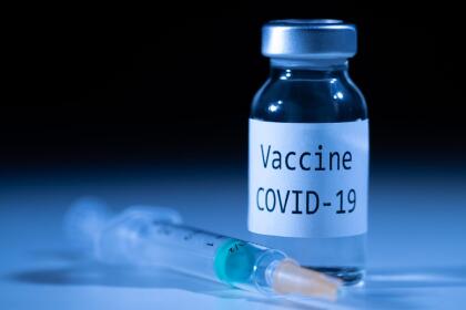 This picture taken on November 17, 2020 shows a syringe and a bottle reading "Vaccine Covid-19". - According to the World Health Organization, some 42 "candidate vaccines" against the novel coronavirus Covid-19 are undergoing clinical trials on November 17, 2020. (Photo by JOEL SAGET / AFP) (Photo by JOEL SAGET/AFP via Getty Images)
