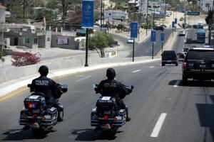 Federal policemen ride their motorcycles