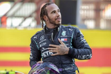 Mercedes driver Lewis Hamilton of Britain celebrates after winning the Formula One Grand Prix of Tuscany, at the Mugello circuit in Scarperia, Italy, Sunday, Sept. 13, 2020. (AP Photo/Luca Bruno, Pool)