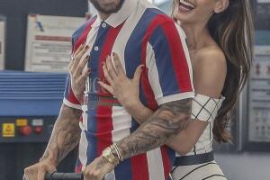 EXCLUSIVE Maluma Rides Scooter Through BCN Airport with Girlfrie