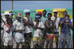 Haitian Men Behind Barbed Wire