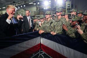 U.S. troops take photos of U.S. President Trump aboard the USS Wasp in Yokosuka