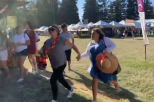 Social media video grab of people running away as an active shooter was reported at the Gilroy Garlic Festival, south of San Jose, California
