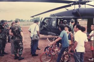Cisneros with reporter by helicopter