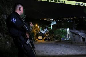 A police officer guards a crime scene in Tlaquepaque