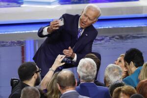 Former Vice President Joe Biden shoots a selfie at the conclusion of the second night of the first U.S. 2020 presidential election Democratic candidates debate in Miami, Florida, U.S.