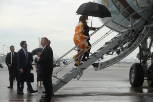 U.S. President Donald Trump and first lady Melania Trump board Air Force One as they depart from Tokyo