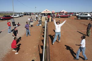 Residents of Naco, Arizona join residents of Naco, Sonora, Mexico for a volleyball match during the fourth "Fiesta Bi-Nacional" at the fence that separates the U.S. and Mexico near Naco