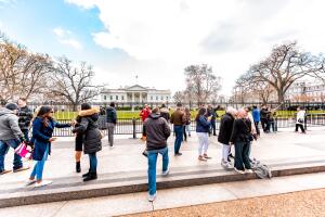 Crowd of many people tourists at White House President building in capital city of United States