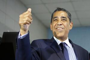 Senator Adriano Espaillat gives a thumbs-up after casting his ballot during the Democratic primary election in New York