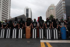 Demonstrators block the street during a protest against the government's austerity measures as Puerto Rico faces a deadline on Monday to restructure its $70 billion debt load or open itself up to lawsuits from creditors, in San Juan
