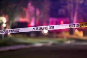 A crime scene is marked off with police tape