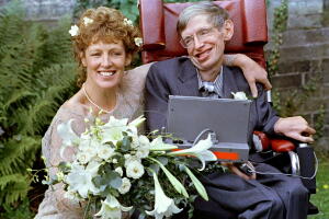 FILE PHOTO: Stephen Hawking and his new bride Elaine Mason pose for pictures after the blessing of their wedding at St. Barnabus Church