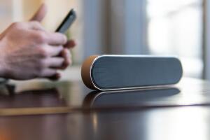 wireless speaker in use. Music lovers and modern audio technology