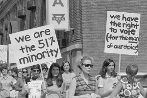 Women Protesters with Large Signs