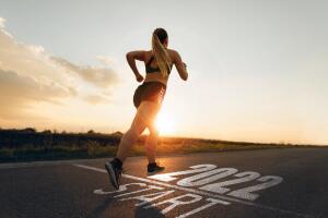 New Year 2022 with new ambitions, challenge, plans, goals and visions. Sporty girl waiting to start the new year 2022.