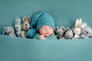 Beautiful,Newborn,Sleeping,With,Knitted,Toys