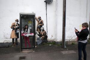 Possible Banksy Artwork Around A Telephone Box