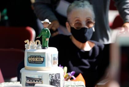 EL SOBRANTE, CALIFORNIA - SEPTEMBER 22: Betty Reid Soskin, the oldest full-time National Park Service ranger in the United States, looks at a birthday cake during a ceremony for the newly renamed Betty Reid Soskin Middle School on September 22, 2021 in El Sobrante, California. Soskin had the school renamed after her on her 100th birthday. She currently works at the Rosie the Riveter/World War II Home Front National Historical Park where she leads tours, speaks to groups and answers questions about living and working in the area during World War Two. Soskin worked as a clerk for the Boilermakers A-36 in Richmond, California during the war. (Photo by Justin Sullivan/Getty Images)