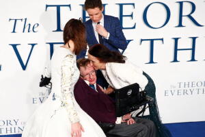 FILE PHOTO: Jane Wilde Hawking kisses her ex-husband Stephen Hawking as she arrives at the UK premiere of the film "The Theory of Everything" at a cinema in central London