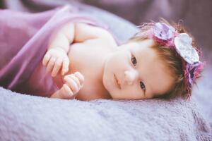 Cute,Little,Child,Lying,On,The,Lilac,,Purple,Plaid