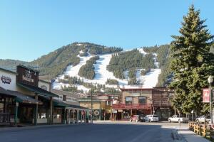 Streets of Jackson Hole with ski slopes at background