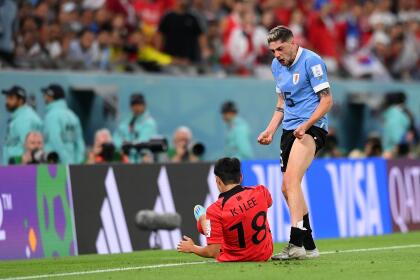 AL RAYYAN, QATAR - NOVEMBER 24: Federico Valverde of Uruguay reacts after his challenge to Kangin Lee of Korea Republic during the FIFA World Cup Qatar 2022 Group H match between Uruguay and Korea Republic at Education City Stadium on November 24, 2022 in Al Rayyan, Qatar. (Photo by Stu Forster/Getty Images)