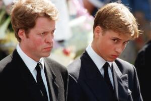 The son of Diana, Prince William (R), an