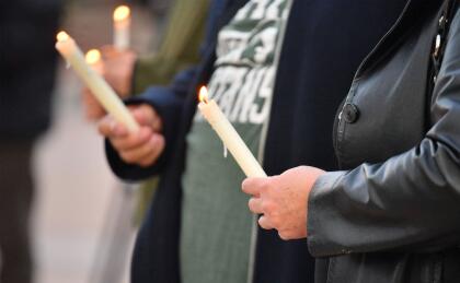 ALBUQUERQUE, NEW MEXICO - OCTOBER 23: People hold candles as they attend a vigil held to honor cinematographer Halyna Hutchins at Albuquerque Civic Plaza on October 23, 2021 in Albuquerque, New Mexico. Hutchins was killed on set while filming the movie "Rust" at Bonanza Creek Ranch near Santa Fe, New Mexico on October 21, 2021. The film's star and producer Alec Baldwin discharged a prop firearm that hit Hutchins and director Joel Souza. (Photo by Sam Wasson/Getty Images)