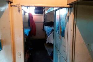 Interior shot of bathroom area within Xu Hai Jun’s shipping container