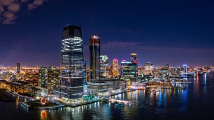 Aerial panorama of Jersey City skyline at night