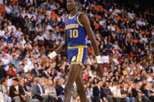 Manute Bol walks