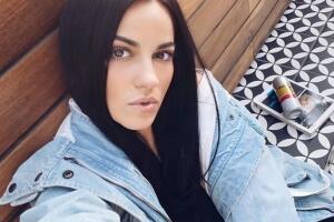 Singer Britney Spears performs with a snake draped