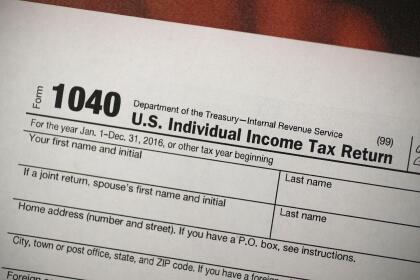 MIAMI, FL - DECEMBER 22: A copy of a IRS 1040 tax form is seen at an H&R Block office on the day President Donald Trump signed the Republican tax cut bill in Washington, DC on December 22, 2017 in Miami, Florida. Kathy Pickering, vice president of regulatory affairs and executive director of The Tax Institute at H&R Block released a statement about the new tax bill saying, " It's going to change the way you think about and plan your income taxes. You'll need to take a fresh look at your individual situation to know your outcome and new strategies to use to get the best tax outcome." (Photo by Joe Raedle/Getty Images)