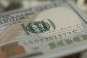 Counterfeit money detection, one hundred dollar bill closeup, banking concept