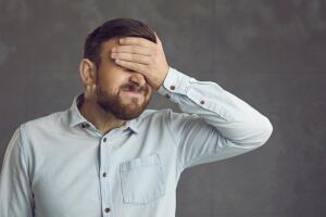 Businessman,Covers,Face,With,Hand.,Guy,Facepalms,Feeling,Ashamed,Of