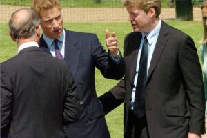Prince William (C) gestures while talkin