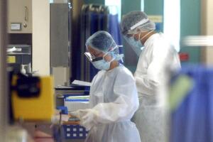 HEALTH WORKERS IN PROTECTIVE GEAR