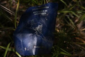 A discarded Nicaraguan passport is seen at a migrant crossing spot on the Rio Grande near Mission