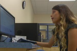 Cassandra checks online to see how much financial aid she received from the federal government.