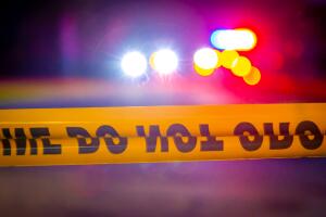 Generic police lights and yellow police tape at crime scene