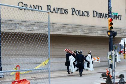 Barriers are set up outside the Grand Rapids Police Department ahead of a march for Patrick Lyoya, a Black man who was fatally shot by a police officer, in downtown Grand Rapids, Michigan, April 16, 2022. - One of four videos from the April 4 incident shows the officer lying on the back of 26-year-old Black man Patrick Lyoya as the two scuffled after a traffic stop and then appearing to shoot him in the head. (Photo by MUSTAFA HUSSAIN / AFP) (Photo by MUSTAFA HUSSAIN/AFP via Getty Images)