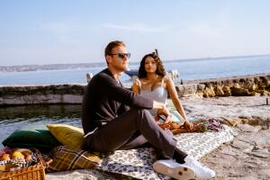 Tom Hopper as Charlie, Kat Graham as Julie in Love In The Villa. Cr. Riccardo GhilardiNetflix.jpg